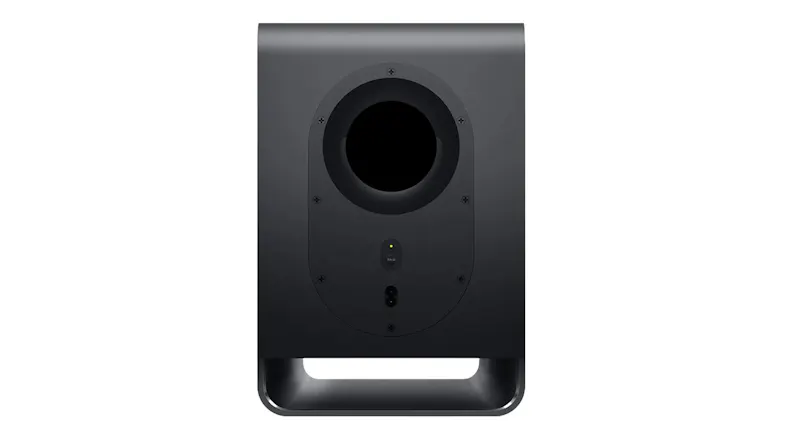 Rear view of a black TCL wireless subwoofer with a bass reflex port, pairing button, and power connector Rear view of a black TCL wireless subwoofer with a bass reflex port, pairing button, and power connector