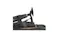 Profile view of the black MOZA Racing mBooster pedal mounted on a base plate with visible actuator and pedal arm Profile view of the black MOZA Racing mBooster pedal mounted on a base plate with visible actuator and pedal arm