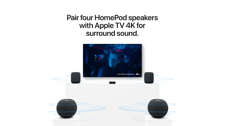 Home theatre setup featuring four speakers paired with television Home theatre setup featuring four speakers paired with television