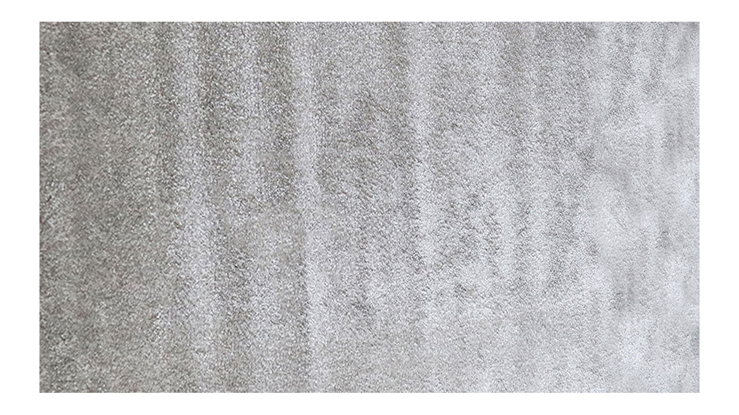 A rectangular silver-coloured rug with a soft, plush texture and subtle gradient shading.