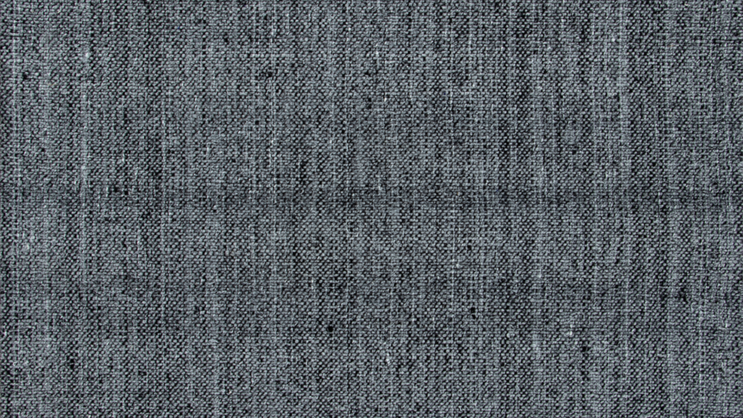 A picture of a grey hand-woven rug.