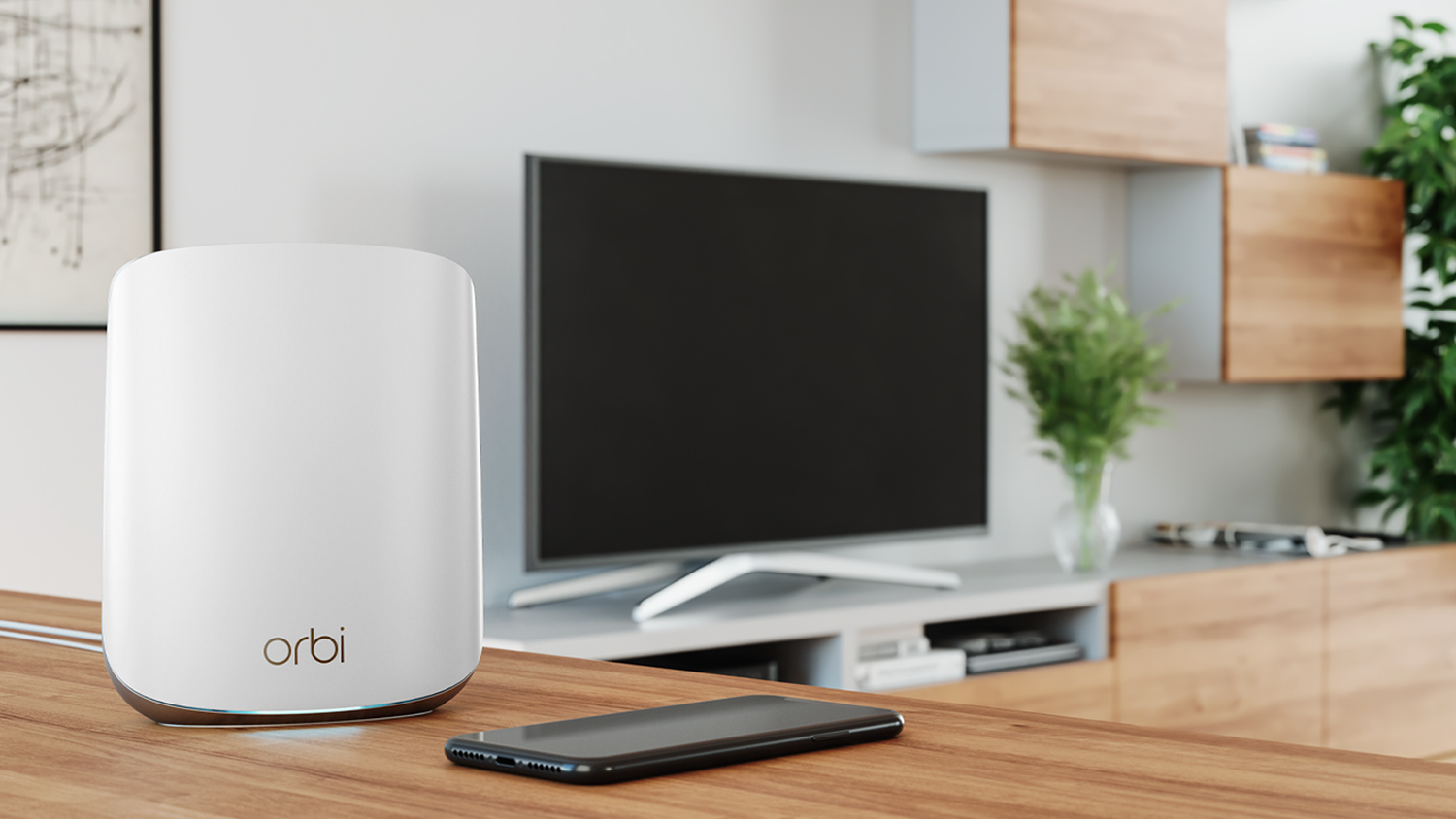 A white Orbi WiFi router sits on a wooden table in a modern living room.