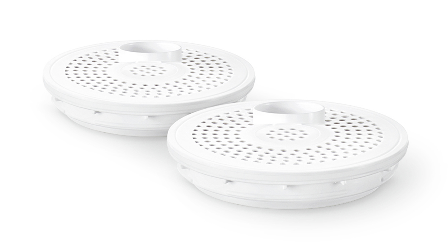Two round white plastic filters with perforated surfaces and central raised openings
