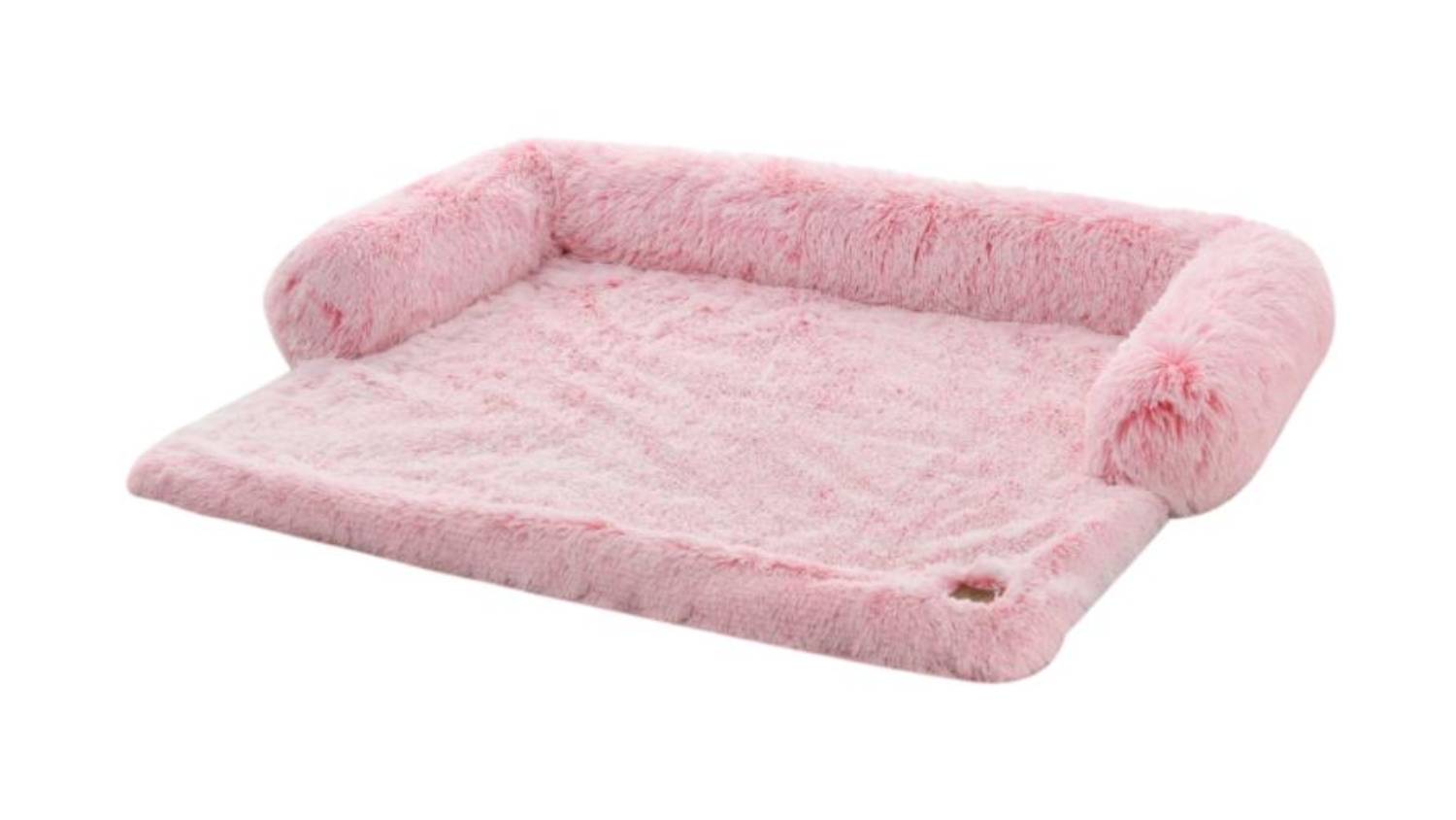 An angled view of Charlie's Faux fur sofa protector in pink ombre colour