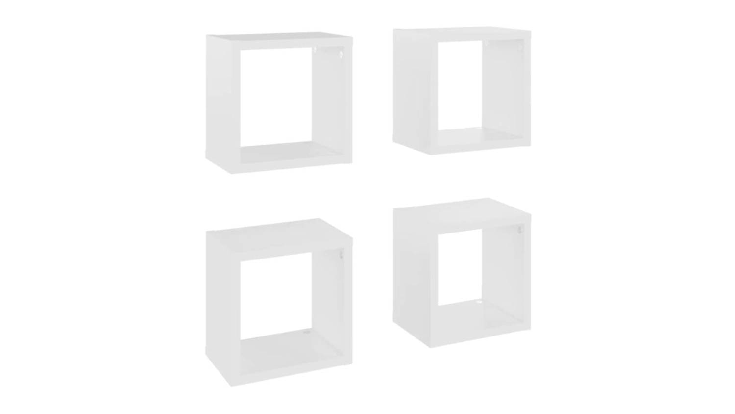 Angled view of four floating cube wall shelves in white, shown in two rows