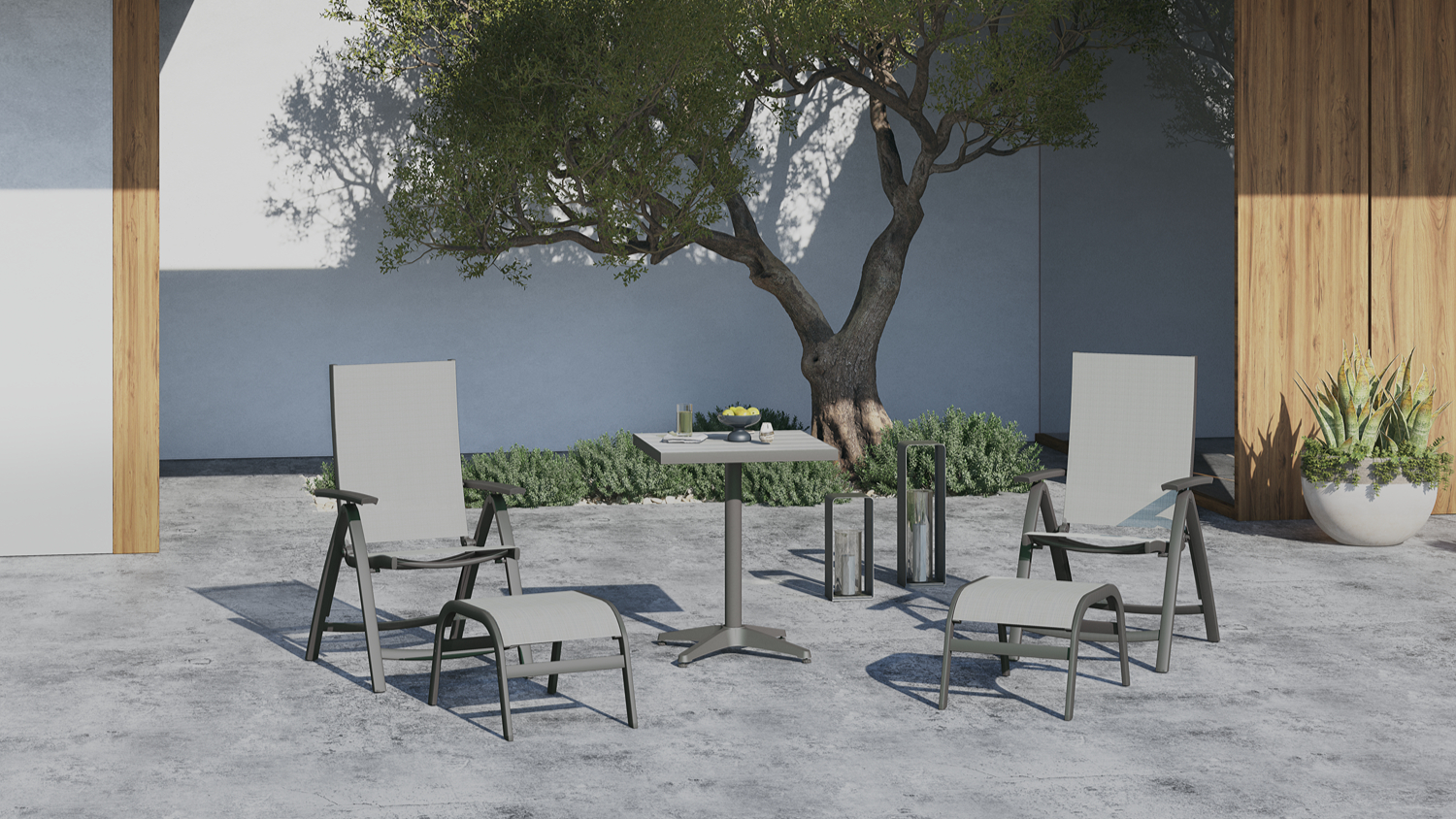 A 5-piece patio furniture in a modern yard with a tree and a large planter in the background.