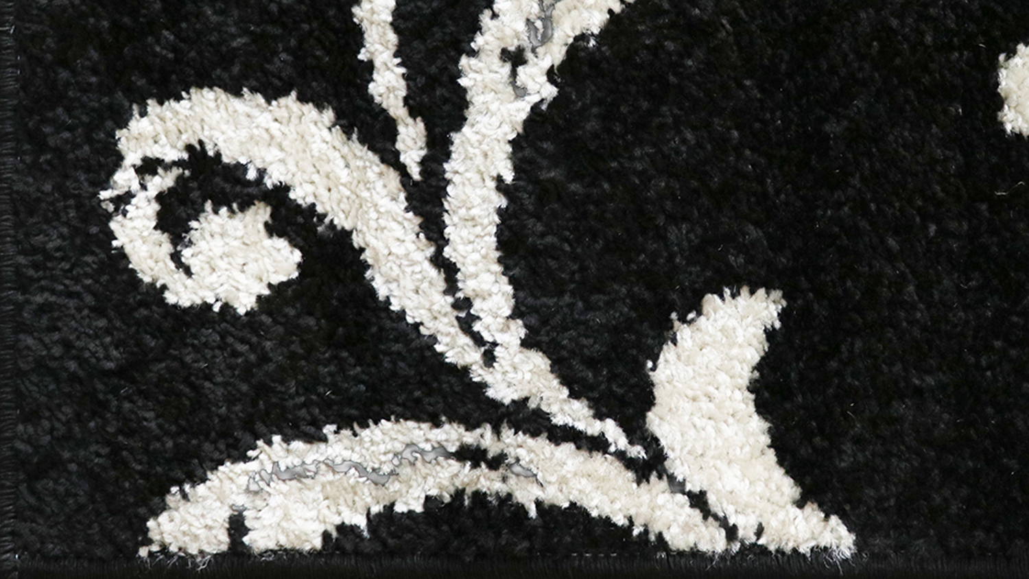 Close-up of Alyssa Rug showing its abstract design in dark and light shades