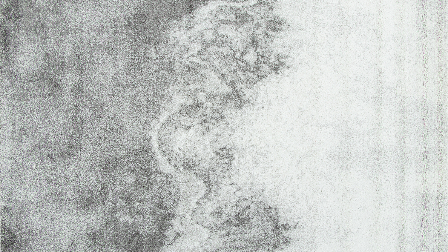 A rectangular rug featuring a blue-toned pattern with subtle distressed textures.