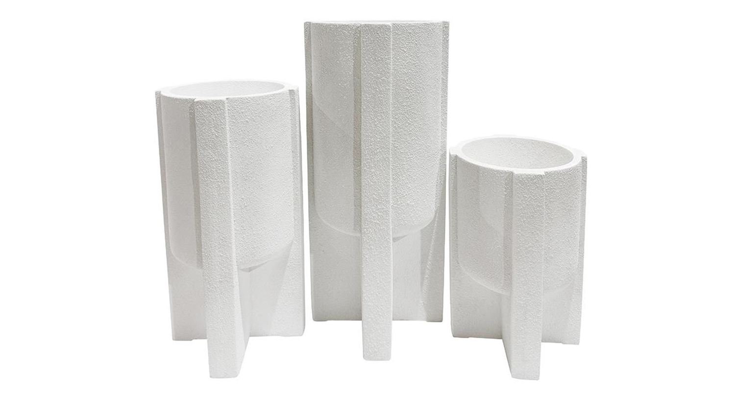 A white textured cylindrical planters