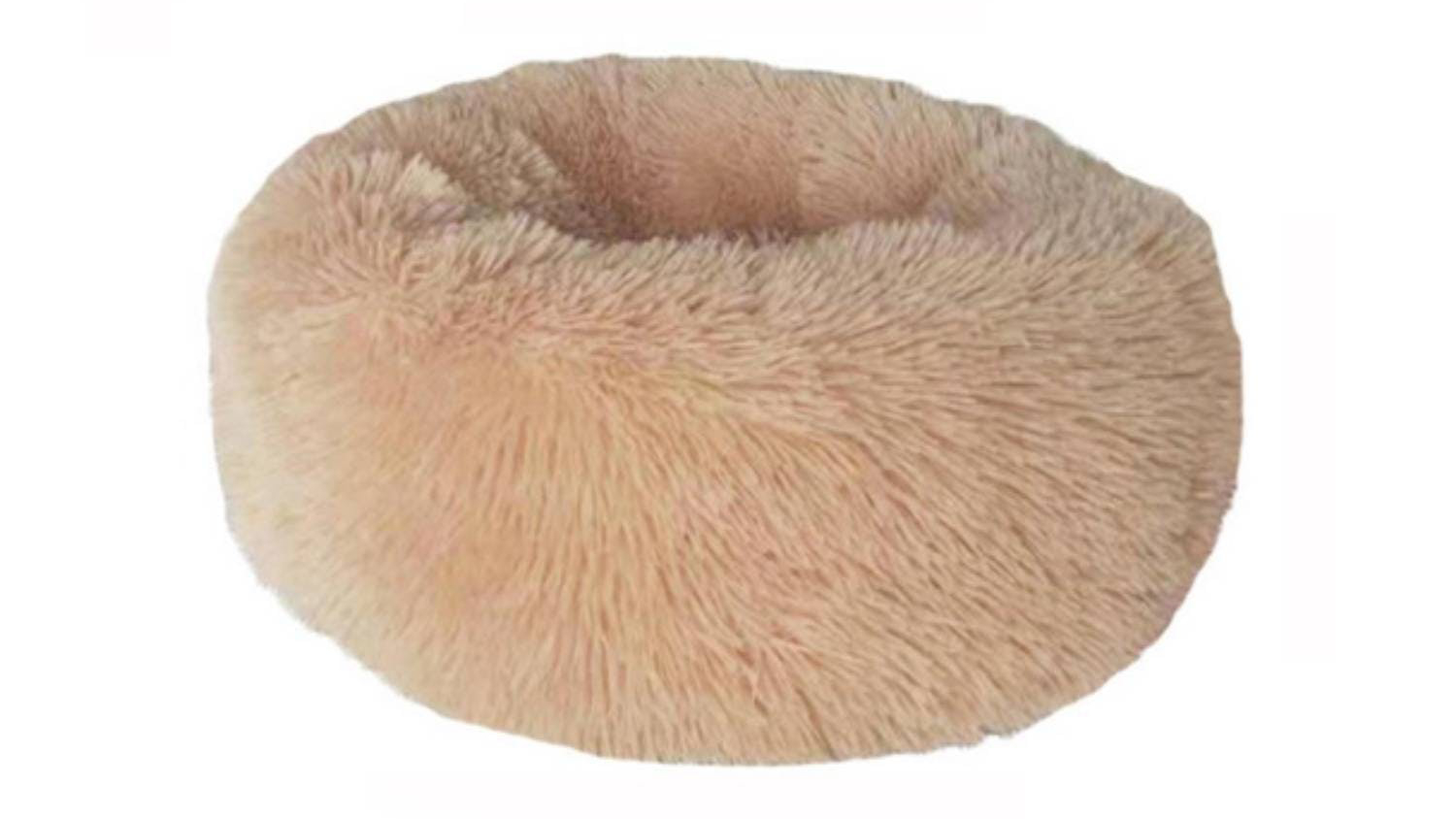 A round, fluffy, khaki pet bed designed for small animals like cats or dogs