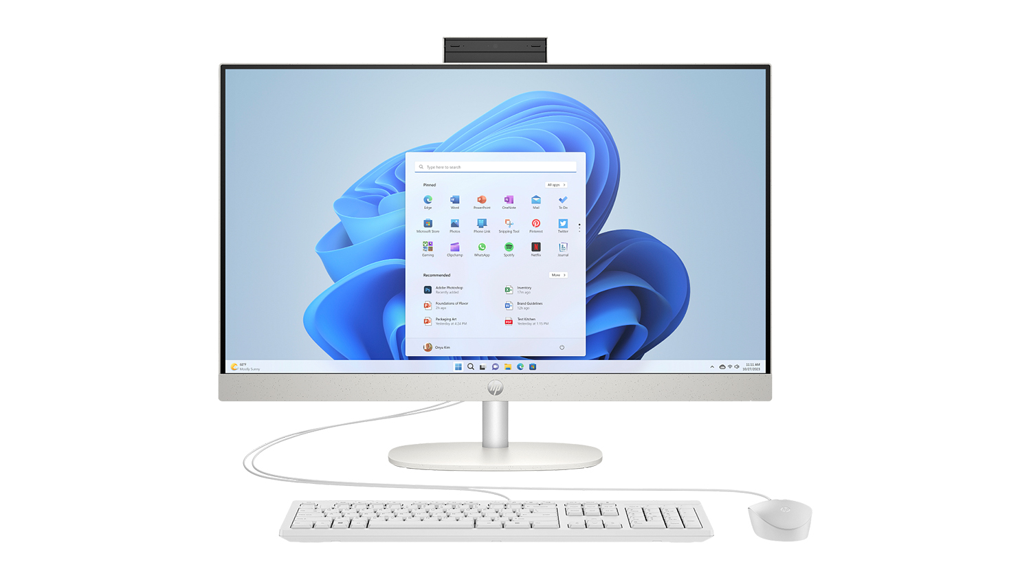 A front view of a sleek HP all-in-one desktop with a keyboard and mouse.
