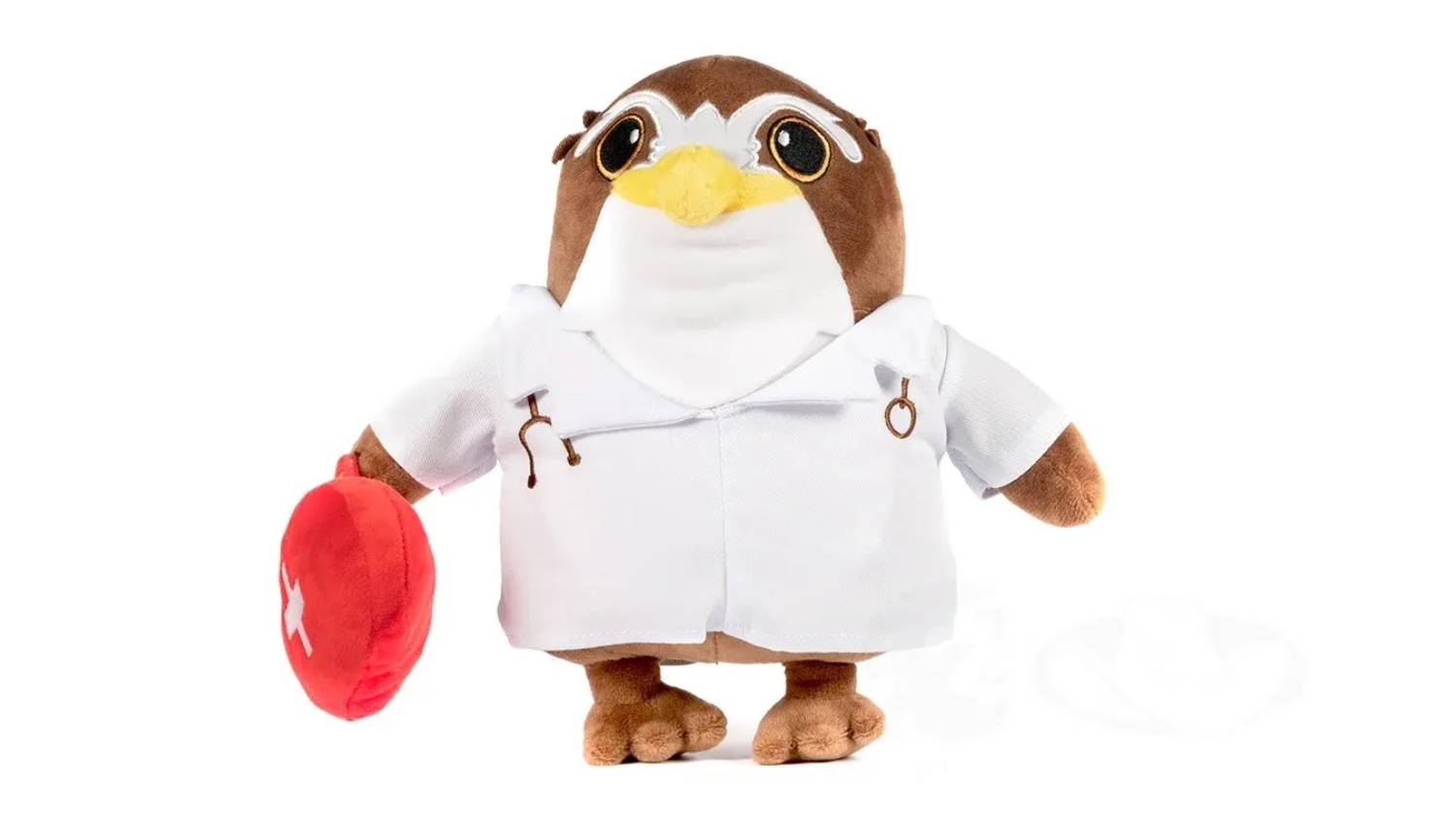 A plush owl toy dressed as a doctor with a lab coat, stethoscope, glasses, and a red medical bag.