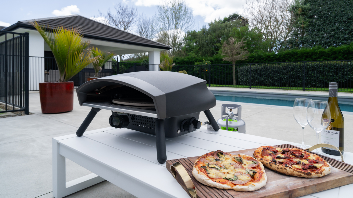 A front-facing view of a Gasmate Portofino Revolve Pizza Oven, highlighting its 360 rotating pizza stone