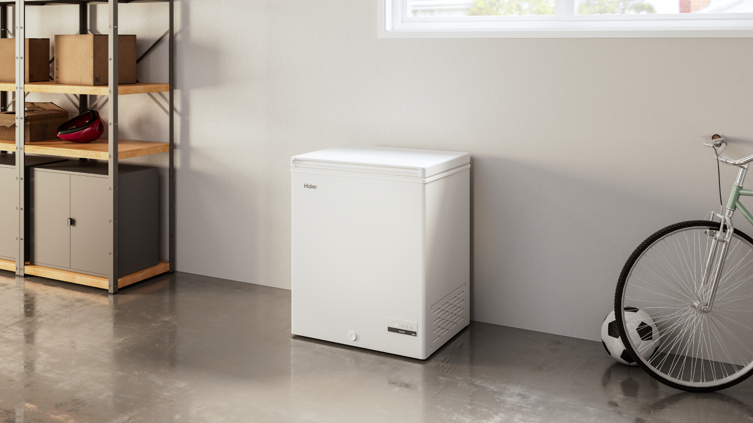 Haier Chest Freezer in a room with shelves on the left and a bicycle on the right