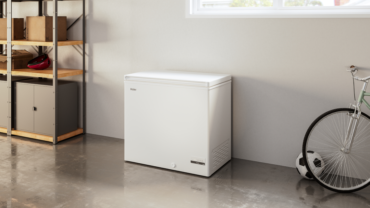 Haier Chest Freezer in a room with shelves on the left and a bicycle on the right