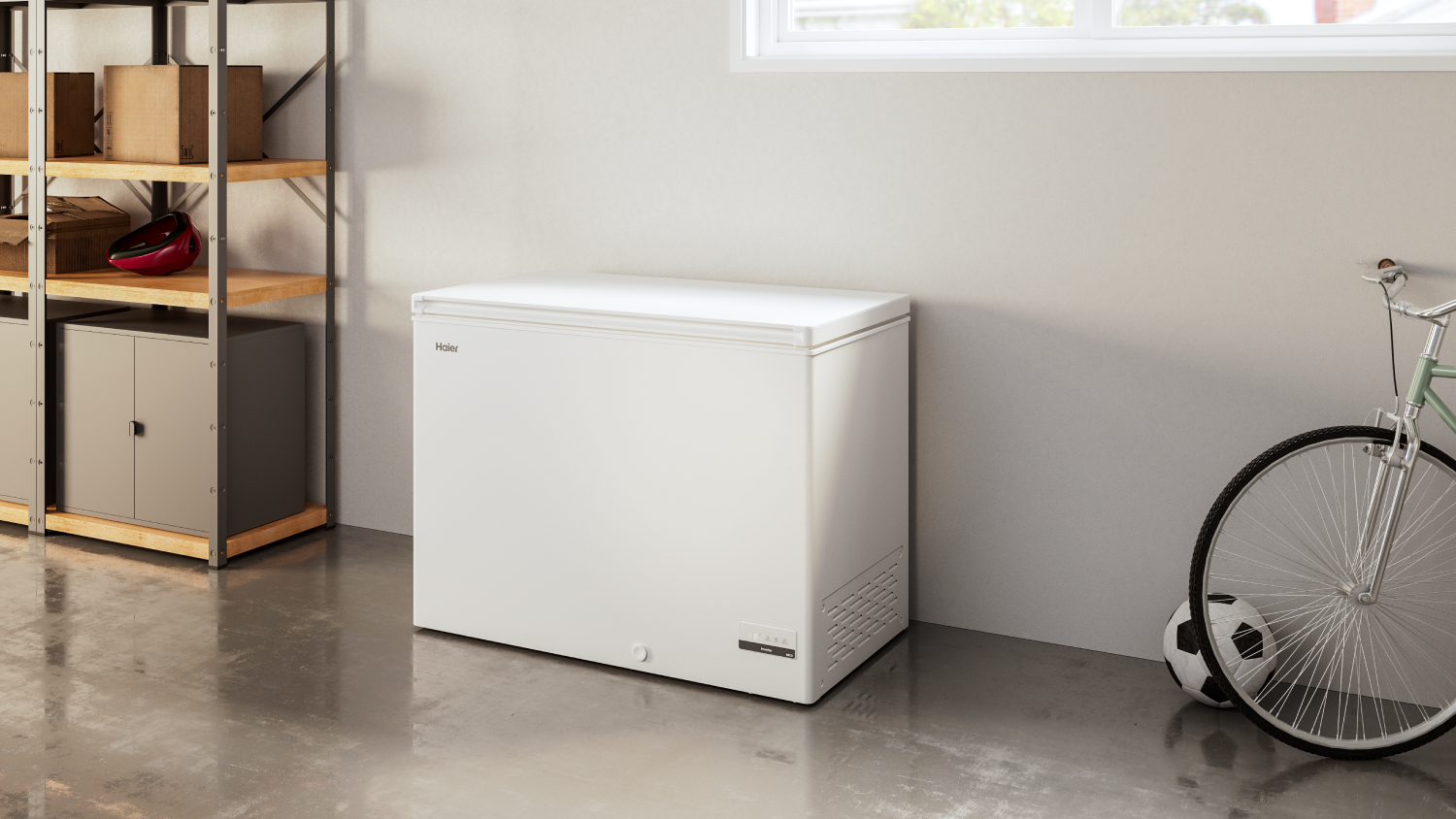 Haier Chest Freezer in a room with shelves on the left and a bicycle on the right