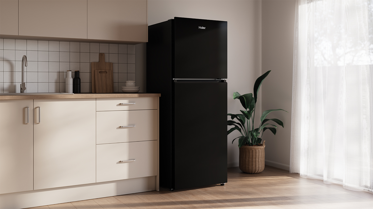 A modern, black fridge freezer in a minimalist kitchen setting