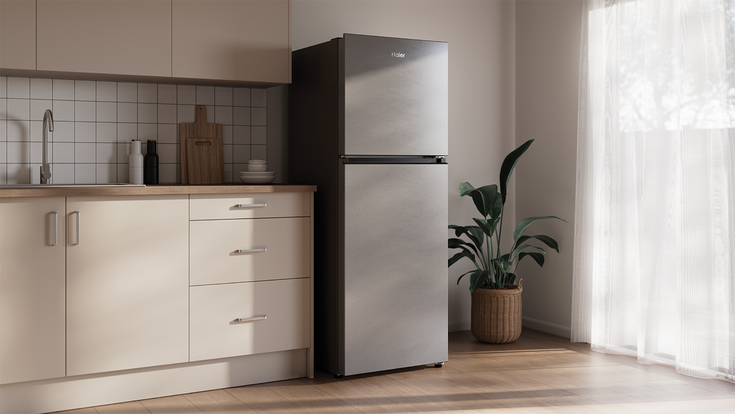 A modern, silver fridge freezer in a minimalist kitchen setting