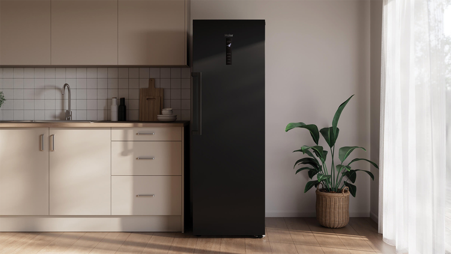 A modern black fridge/freezer in a minimalist kitchen setup