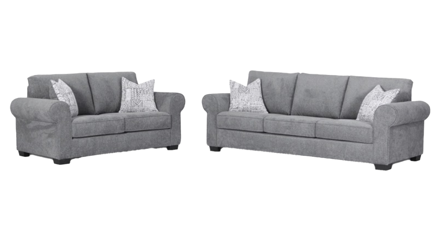 Two grey sofas, one large and one small, each styled with patterned throw pillows