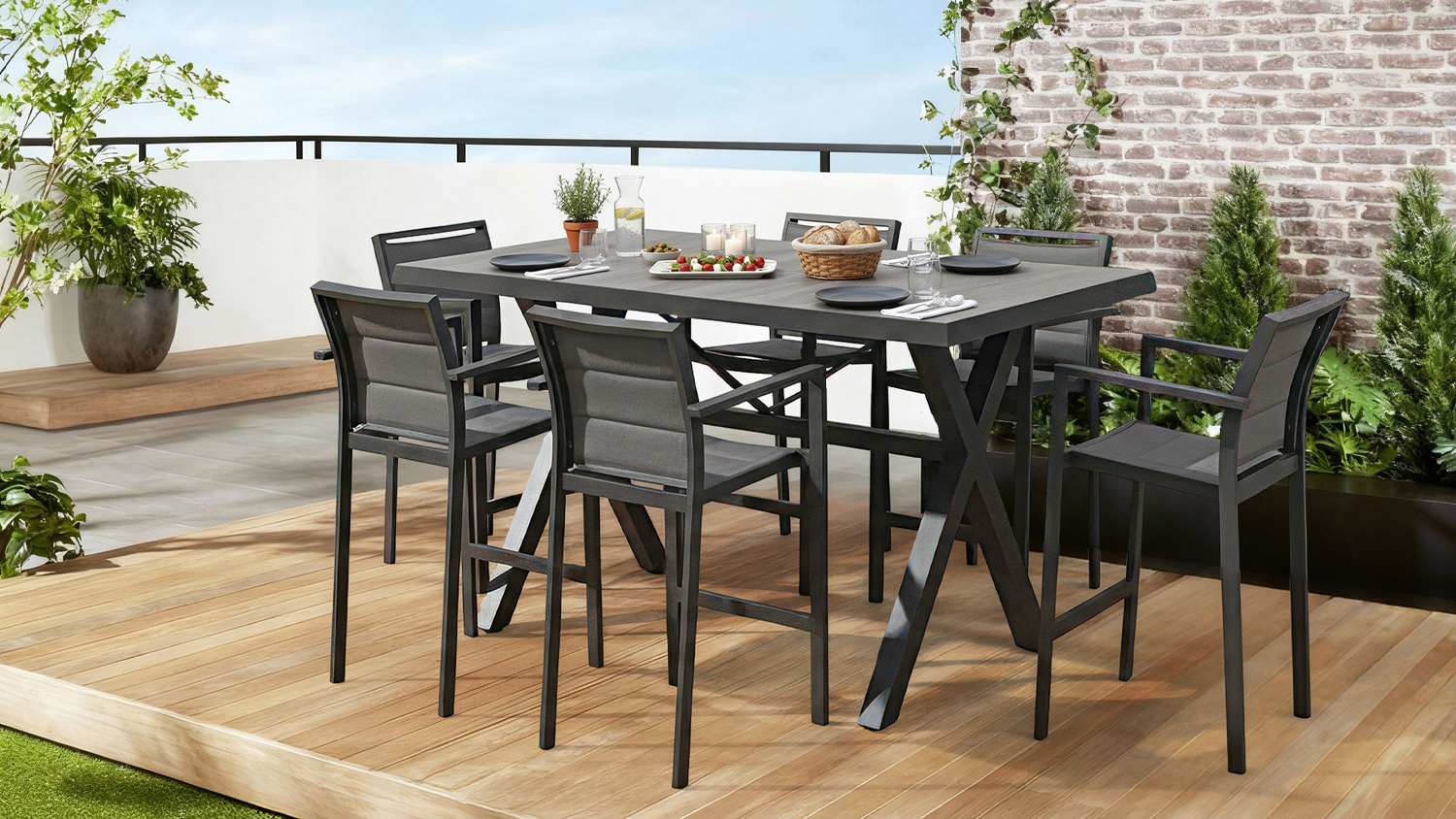 A dark coloured, rectangular outdoor dining set with a high table and six tall chairs