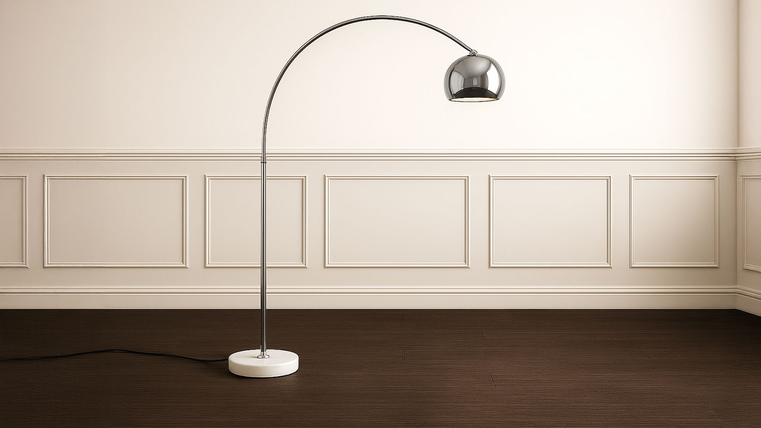 A modern chrome-coloured floor lamp with a curved metal arm and dome-shaped shade