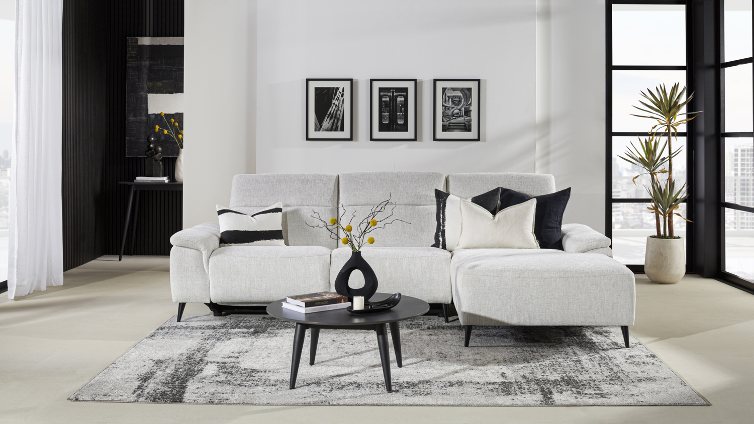 Front view of a three-seater electric reclining sofa in beige upholstery, with a right-side chaise