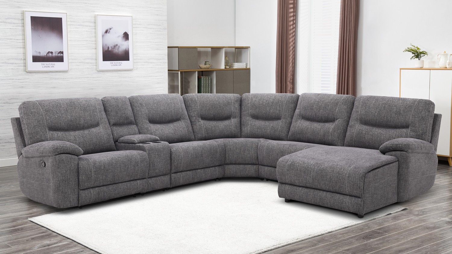A modern living room featuring a large grey L-shaped sectional sofa