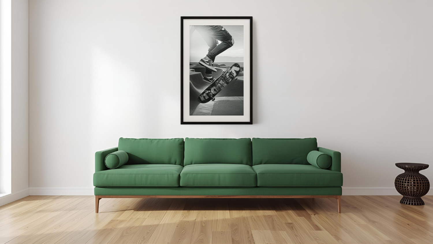Framed photo hangs above sofa in a modern living room with light wood flooring.