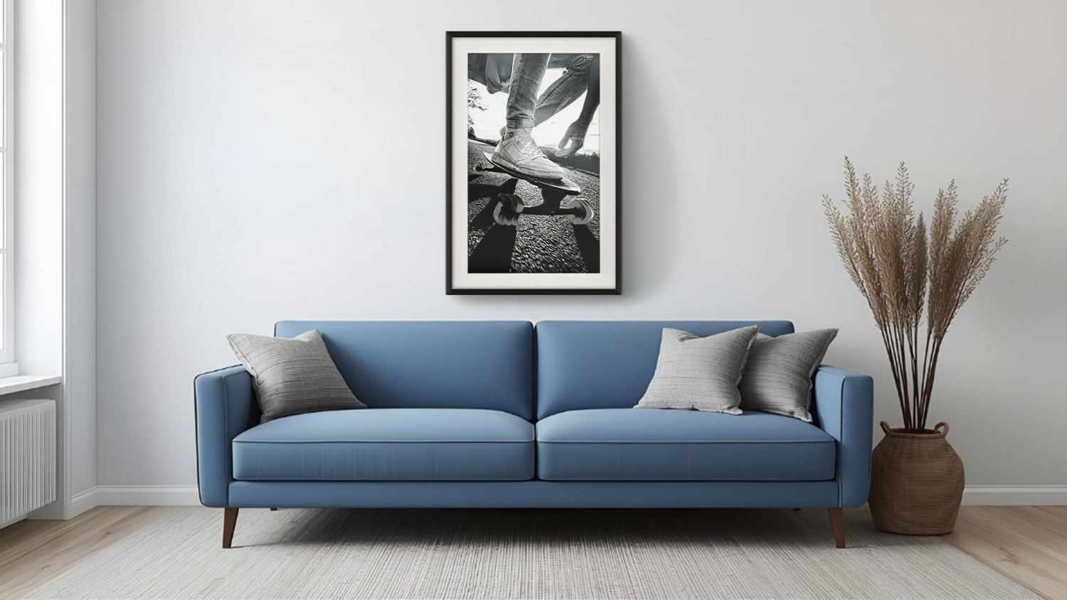 Framed photo hangs above light blue sofa with cushions in a modern living room with vase.