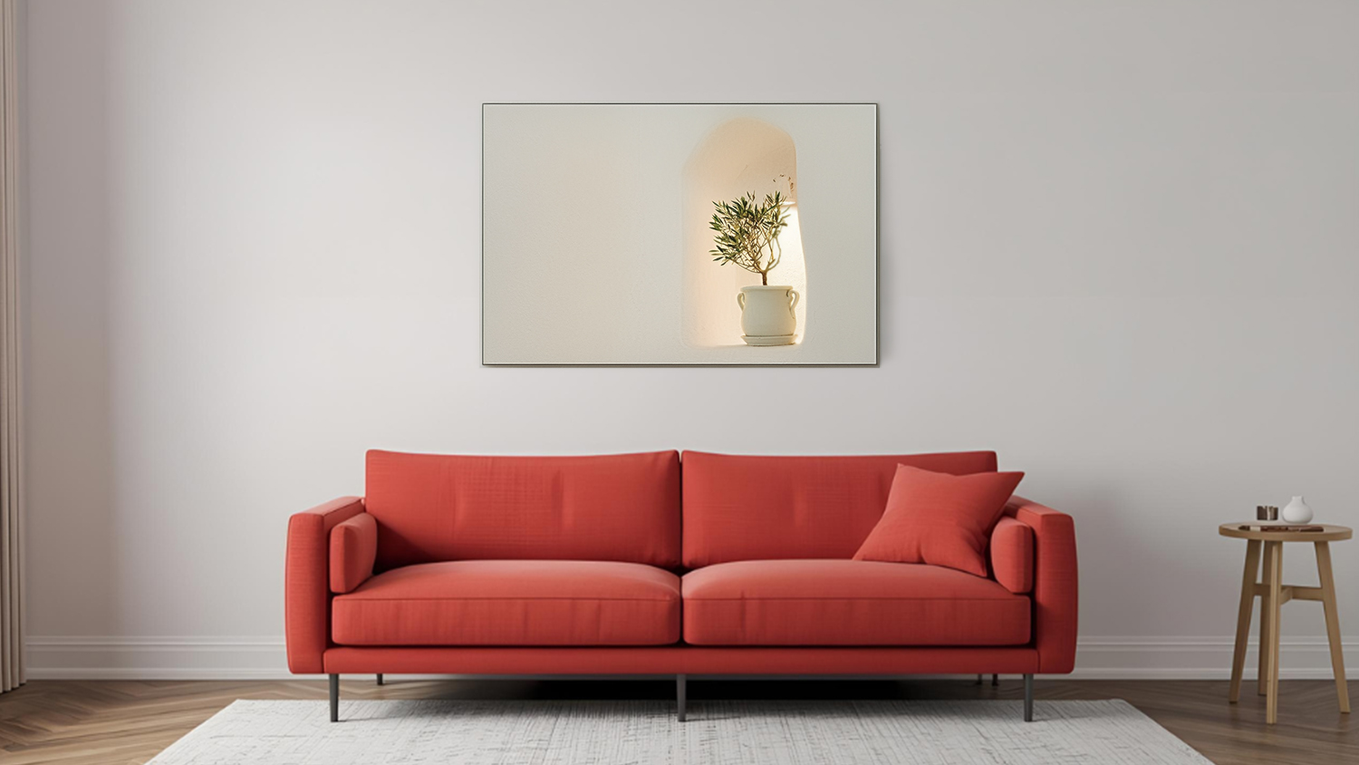 Framed photo hangs above sofa in a modern living room with wooden flooring.