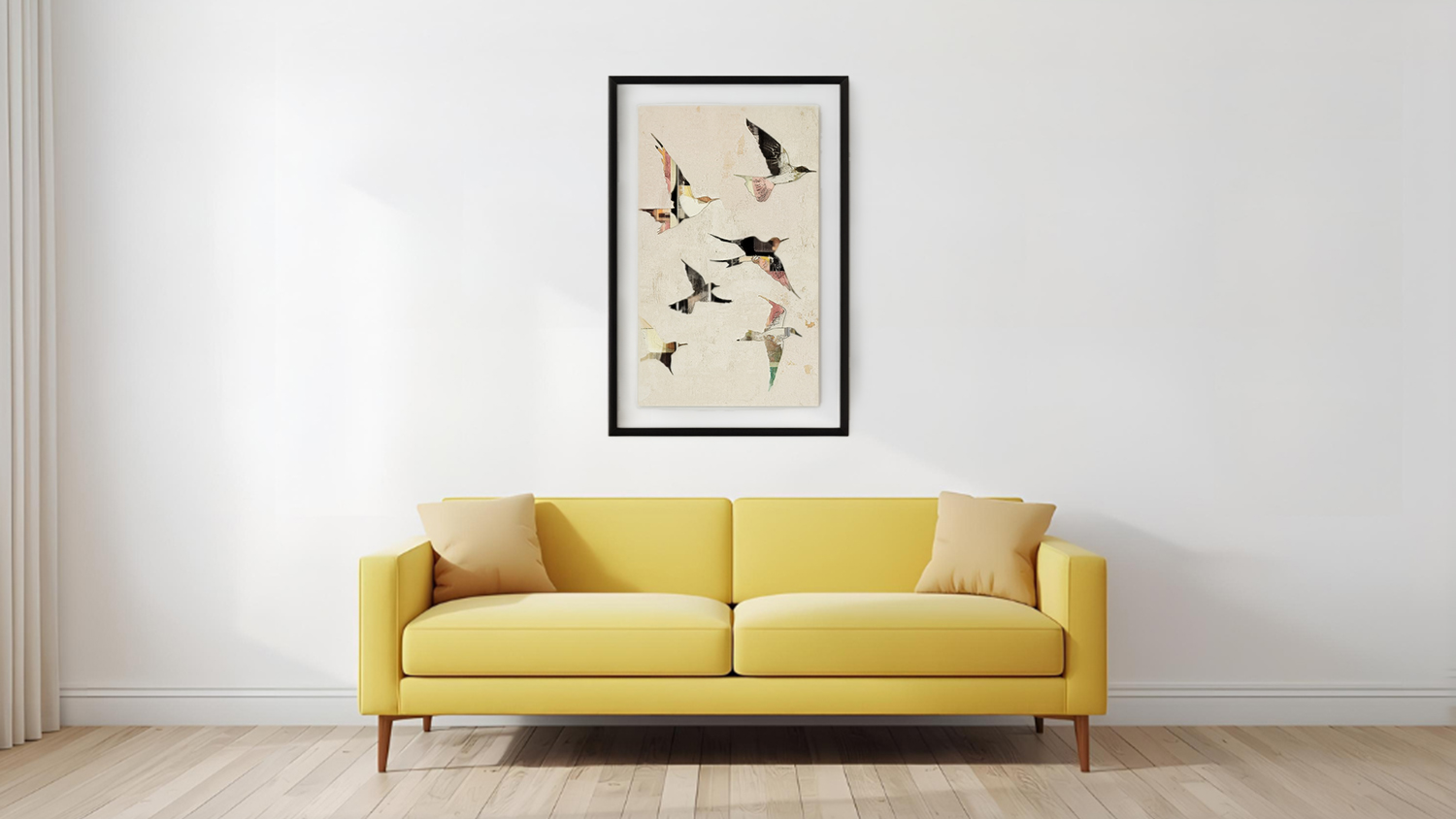 Framed photo hangs above sofa in a modern living room with wooden flooring.