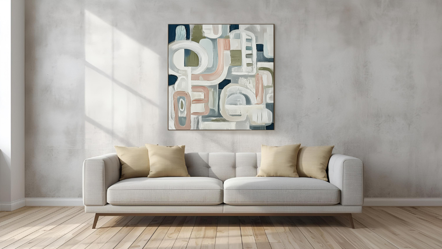 Framed photo hangs above sofa in a modern living room with wooden flooring.