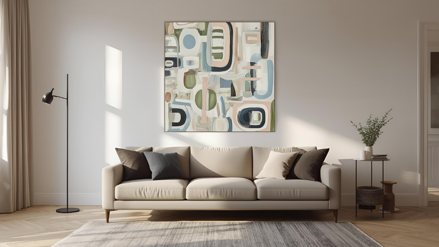 Framed photo hangs above sofa in a modern living room with wooden flooring.