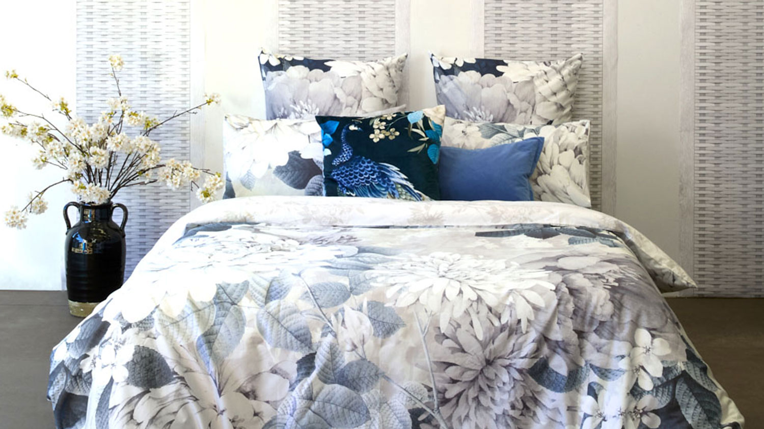 A chrysanthemum silver duvet cover set in a cosy room
