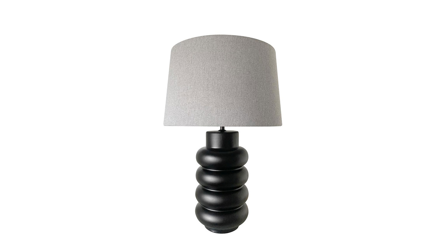 Cannes 59cm Black Ceramic Table Lamp, bold with modern elegance, casting a warm inviting glow.
