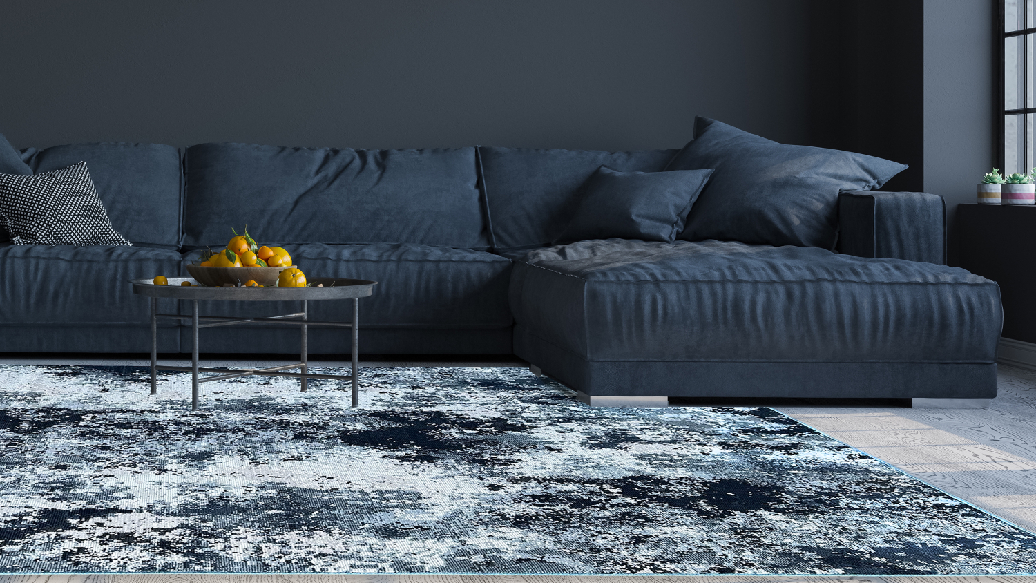 Living room with dark blue sofa and blue-grey abstract rug.