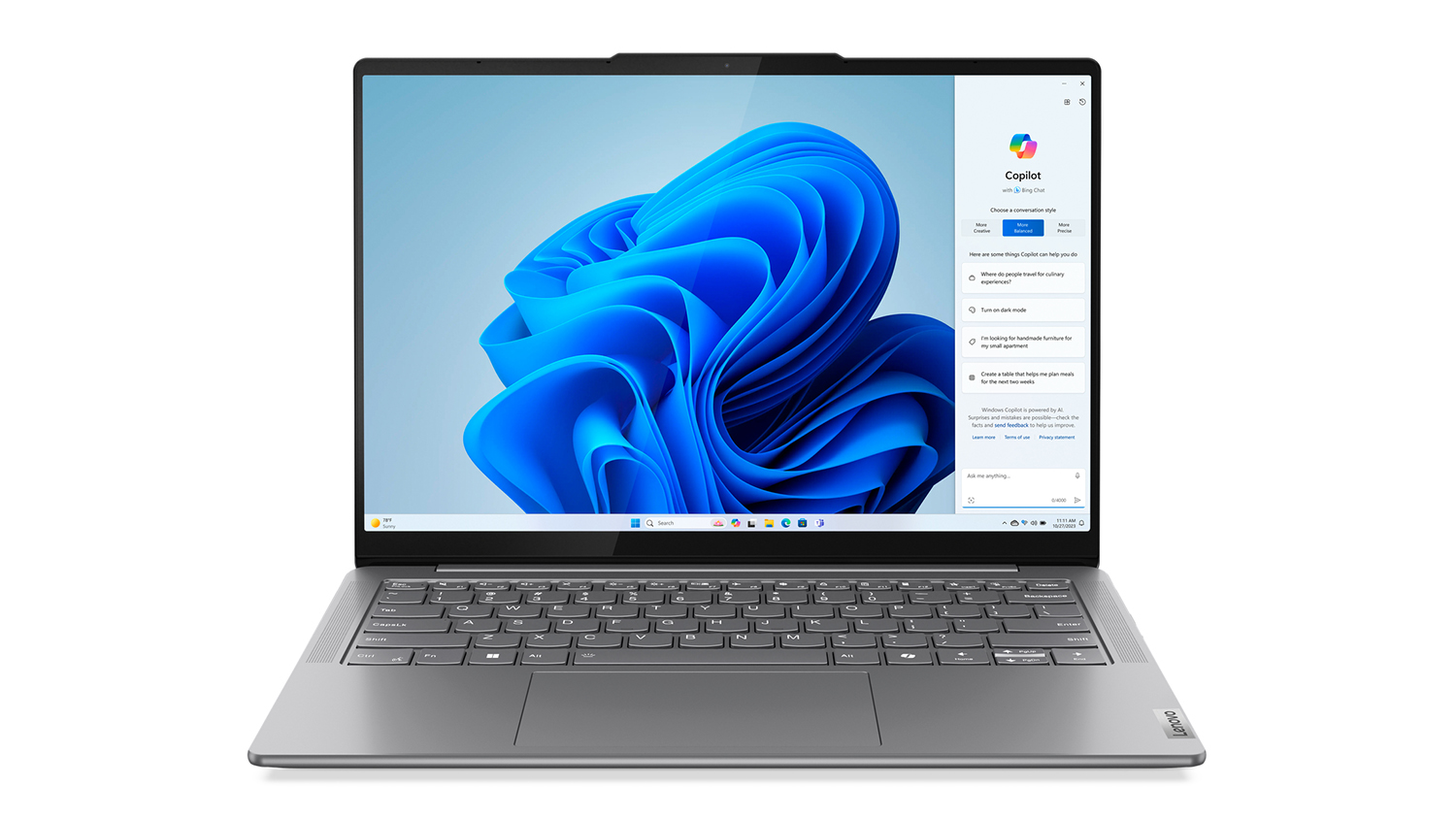 A Luna Grey Lenovo Yoga Slim 7i (9th Gen) 14" laptop showing an open Copilot screen