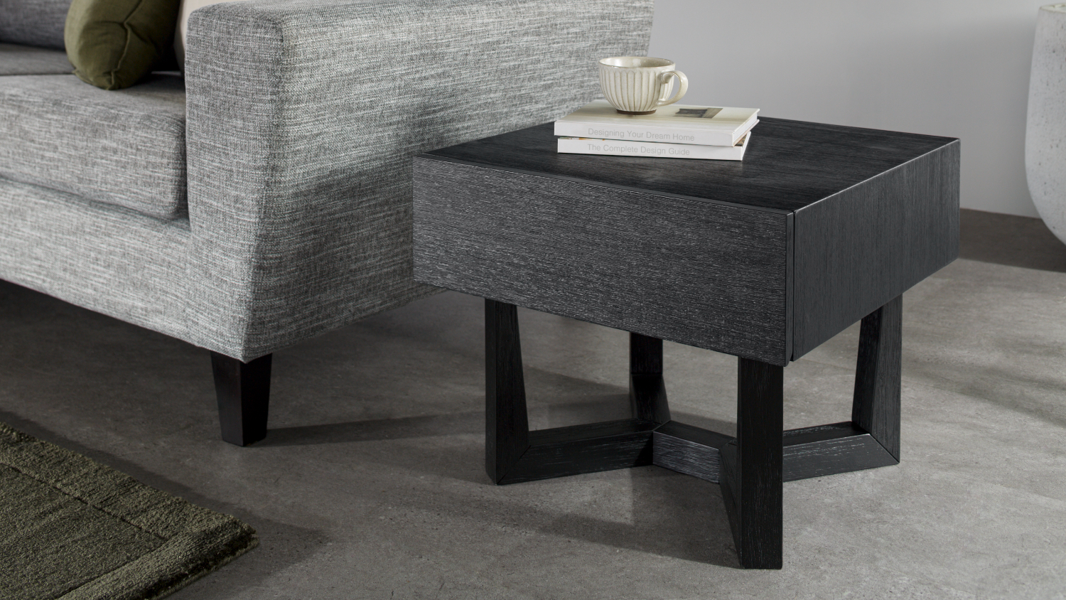 A view of the lamp table beside a modern sofa