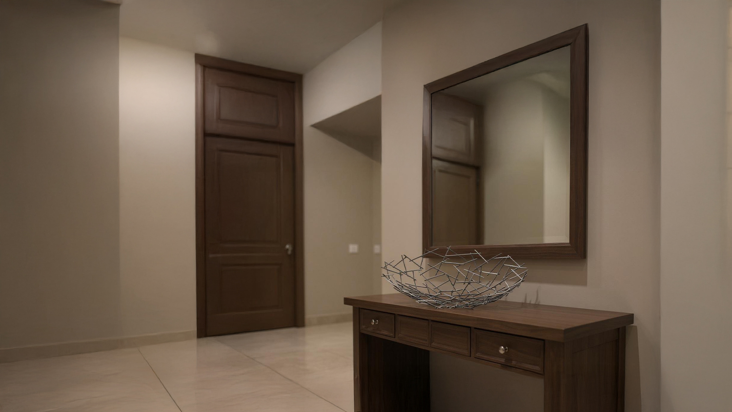 Abstract metal bowl centered on a dark wood table in a modern hallway