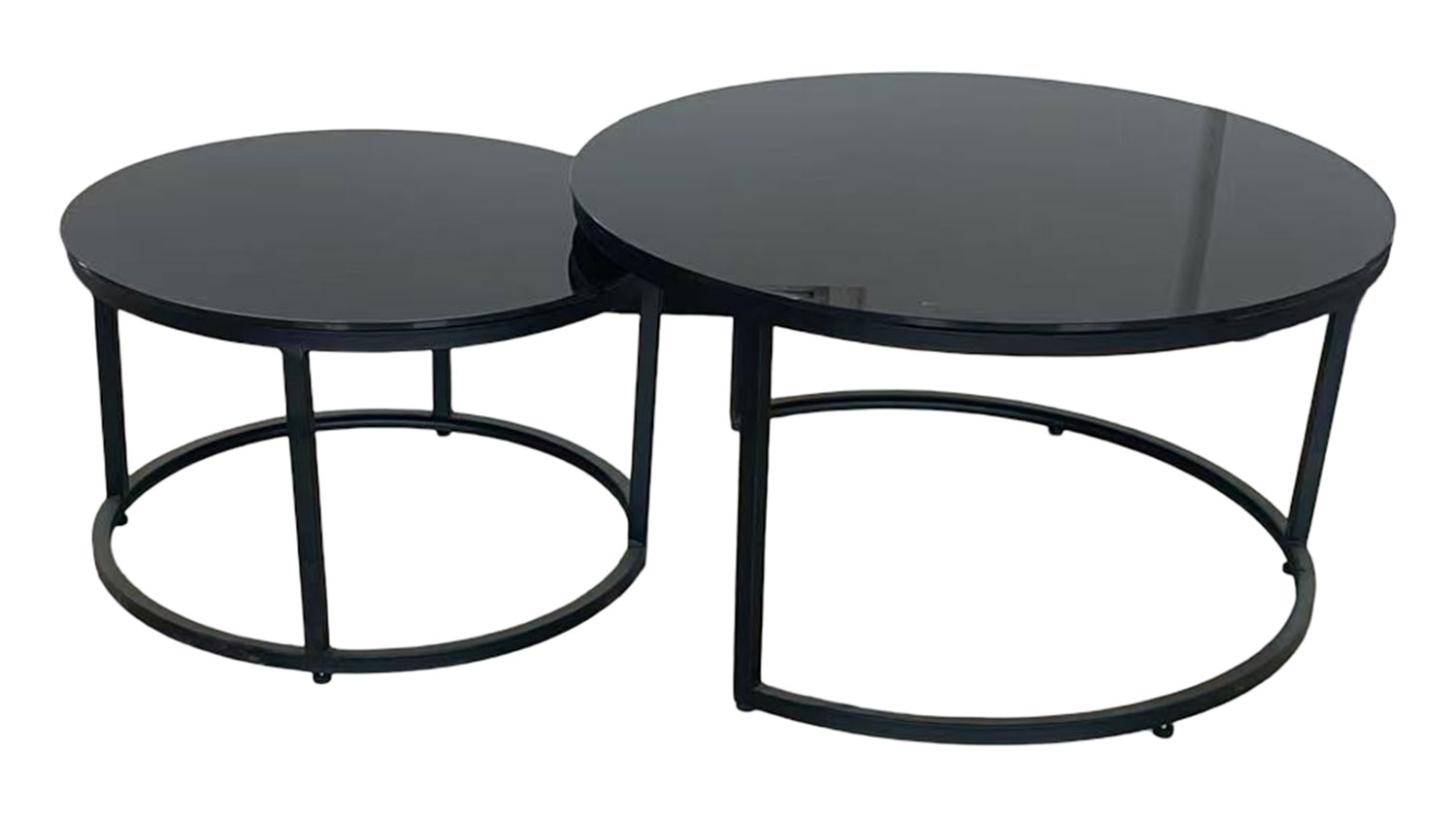 Cielo Nest of 2 Tables. Two stylish round black glass nesting tables with metal frames, one slightly smaller and tucked under.