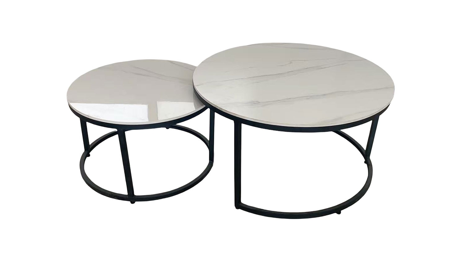 Comet Nest of 2 Tables. Two sleek, contemporary round white sintered stone nesting tables with black metal frames, one slightly smaller and tucked under.