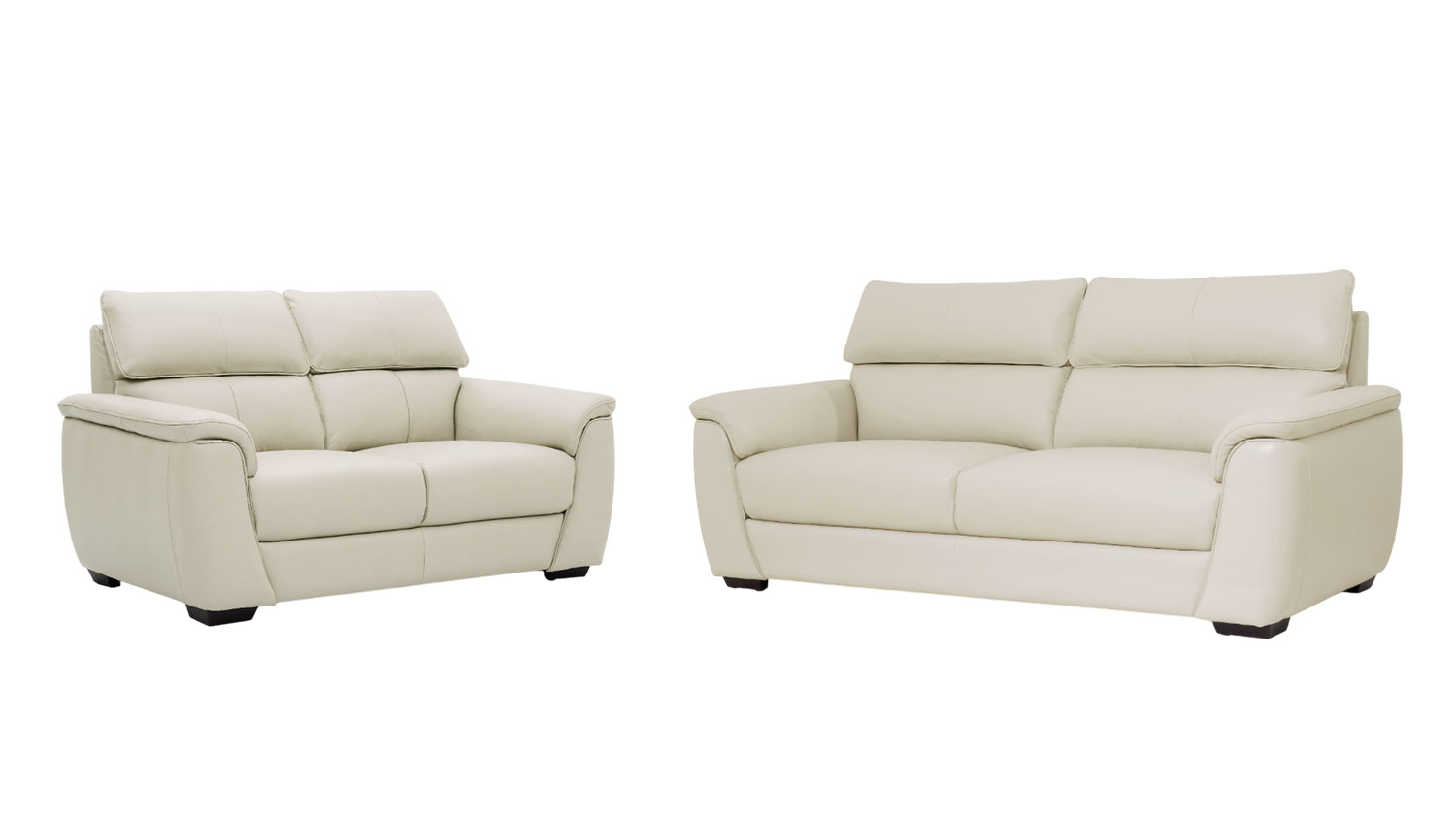 A modern leather sofa in Oslo frost cream colour with backrest cushions, padded armrests, and short dark wooden legs