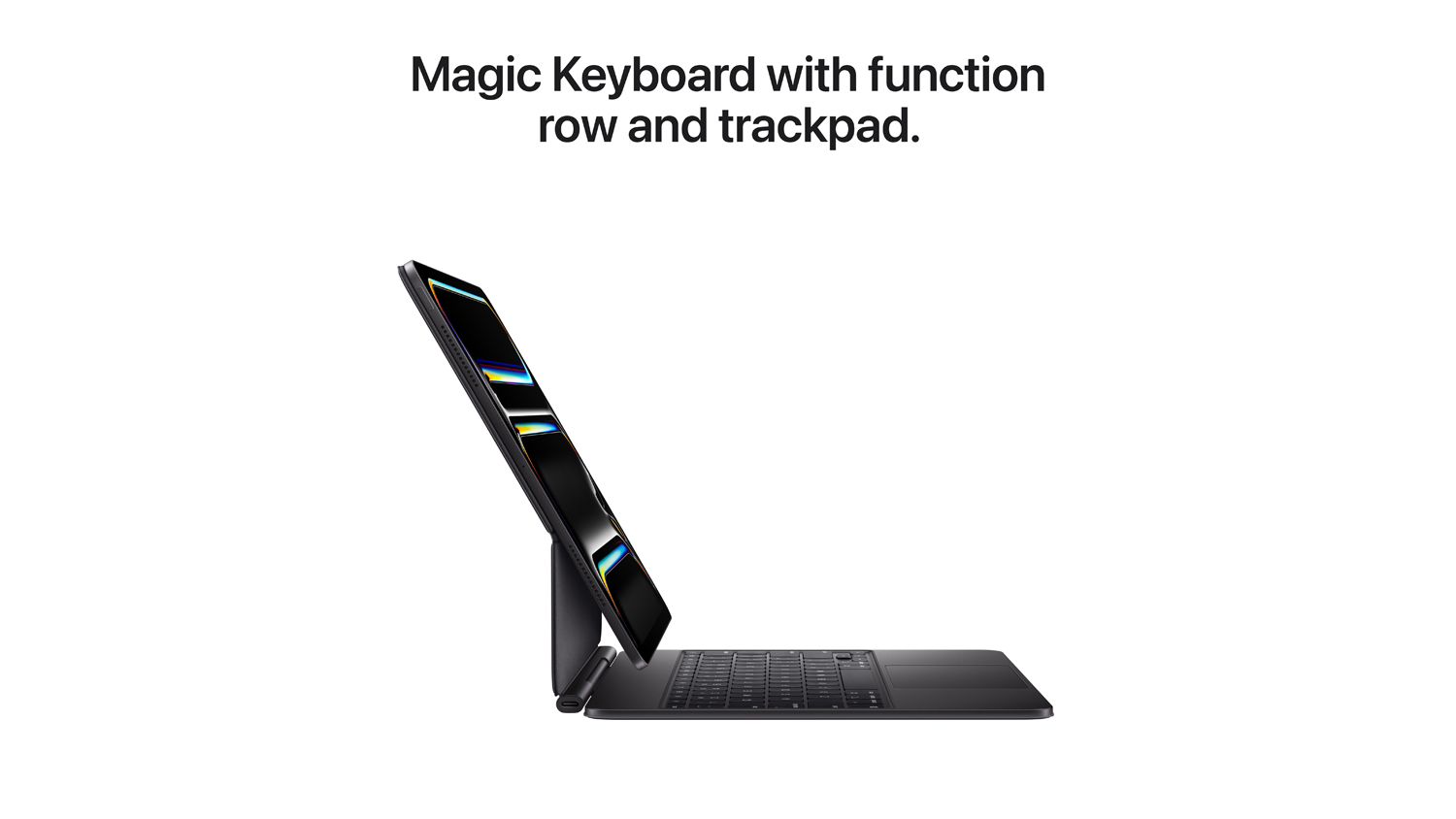 Side profile of the iPad Pro attached to the Magic Keyboard with function row and trackpad