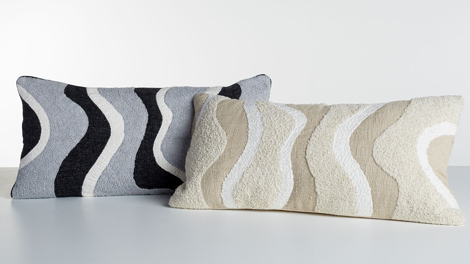 Yemen Breakfast Cushion by L'Avenue, cushion with abstract vertical pattern of neutral tones cream, tan, white.