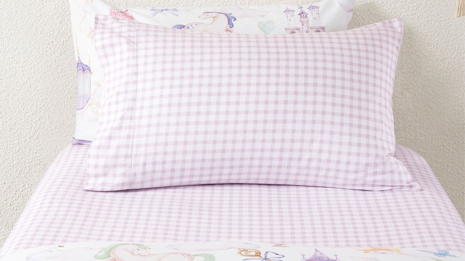 A Charlie Orchid fitted sheet set with a white and pink check pattern