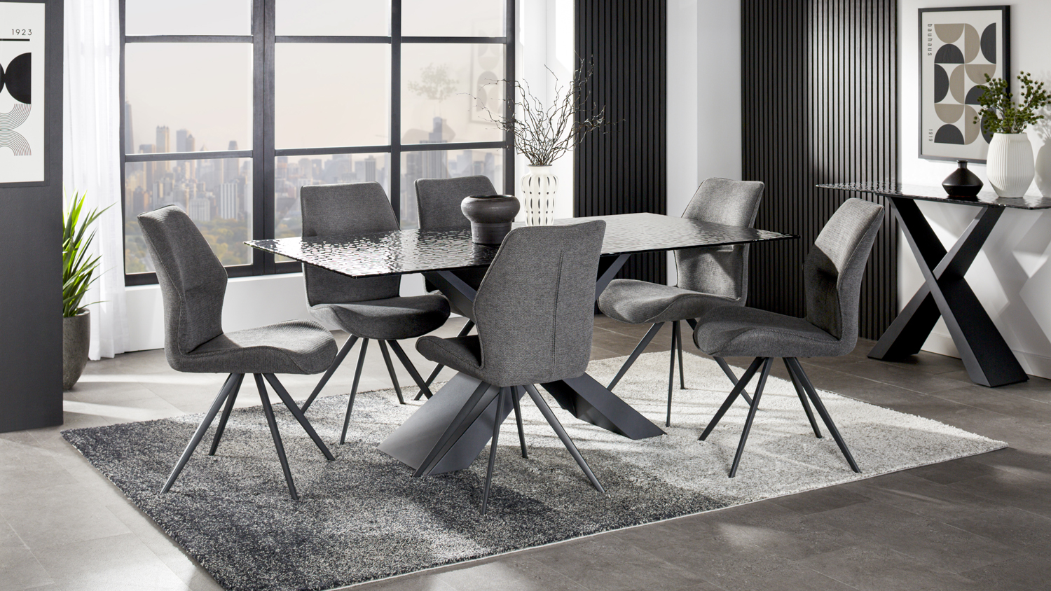 Modern dining room featuring the Lumicera 7-piece suite with a glass tabletop and six grey upholstered chairs