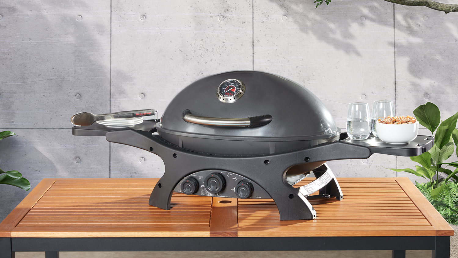 Ziggy Classic 3 Burner Gas BBQ in gunmetal grey with a domed hood, built-in thermometer, and stainless steel handle