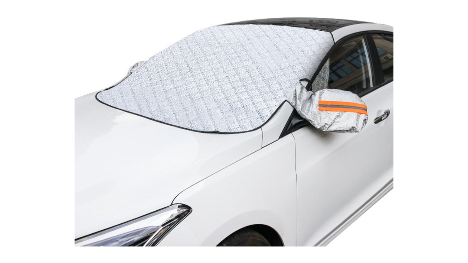 Ultra-thick magnetic windshield cover on a white car, protecting glass and mirrors from snow, frost, and UV rays