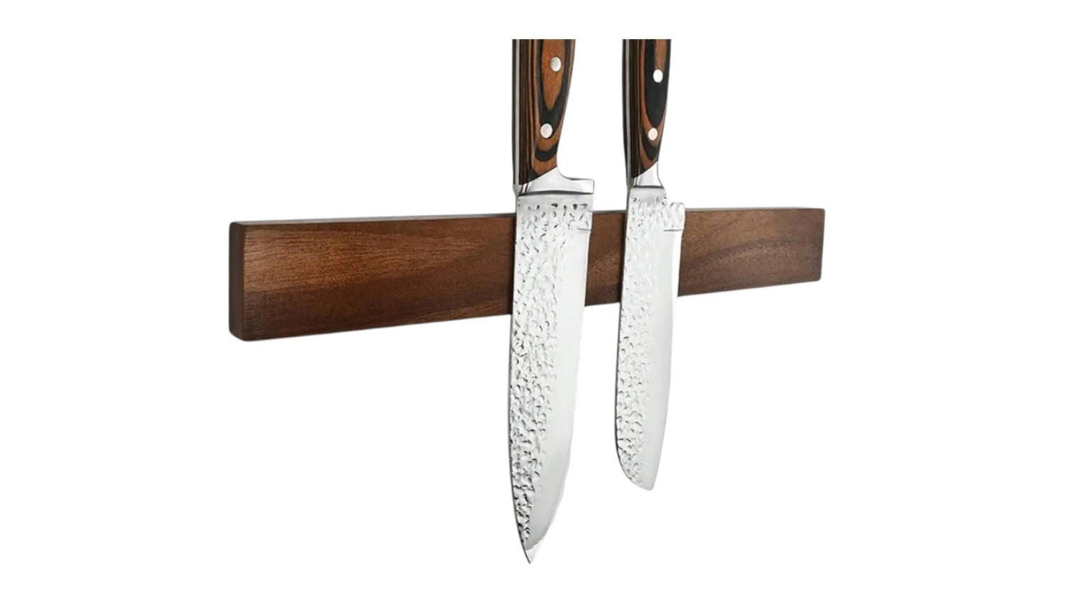 Wooden magnetic knife holder mounted on the wall, holding two stainless steel knives